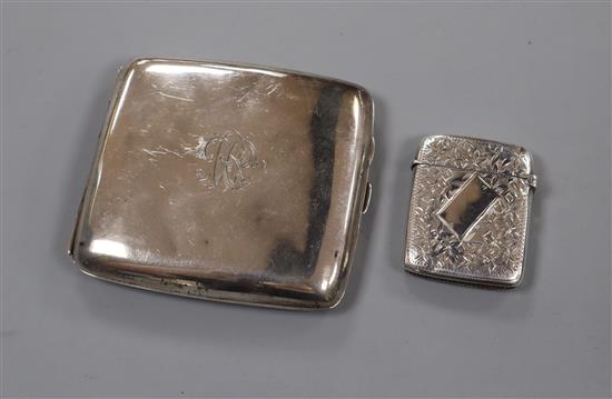 A silver cigarette case and a silver vesta case.